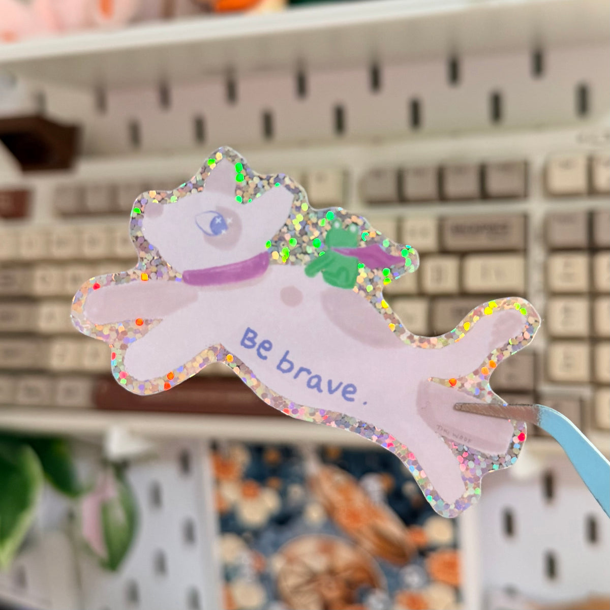 Be Brave Glitter Sticker featuring pastel leaping animal with a teacup and Be Brave lettering.