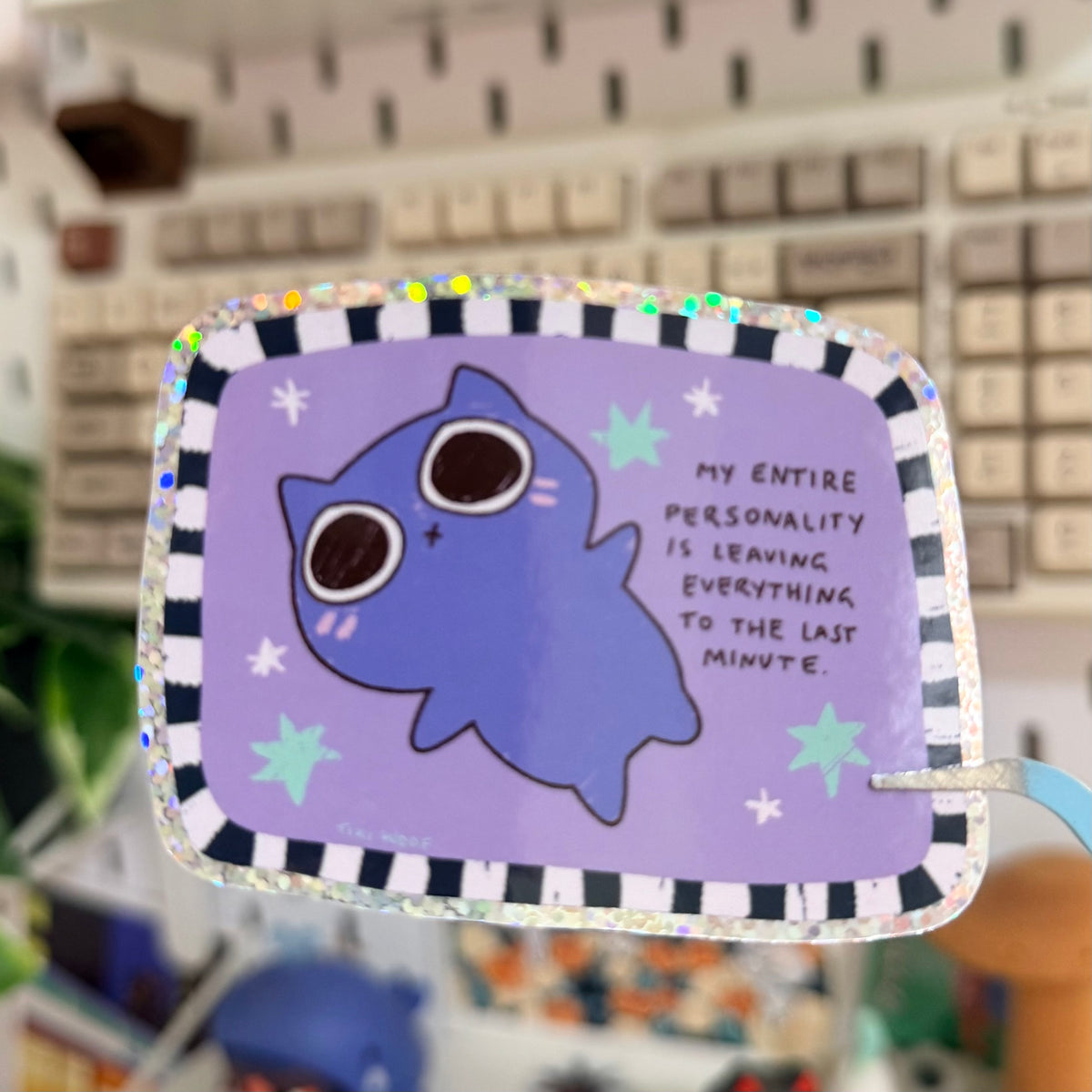 Entire Personality Glitter Sticker featuring purple character on a starry design with a personality quote.