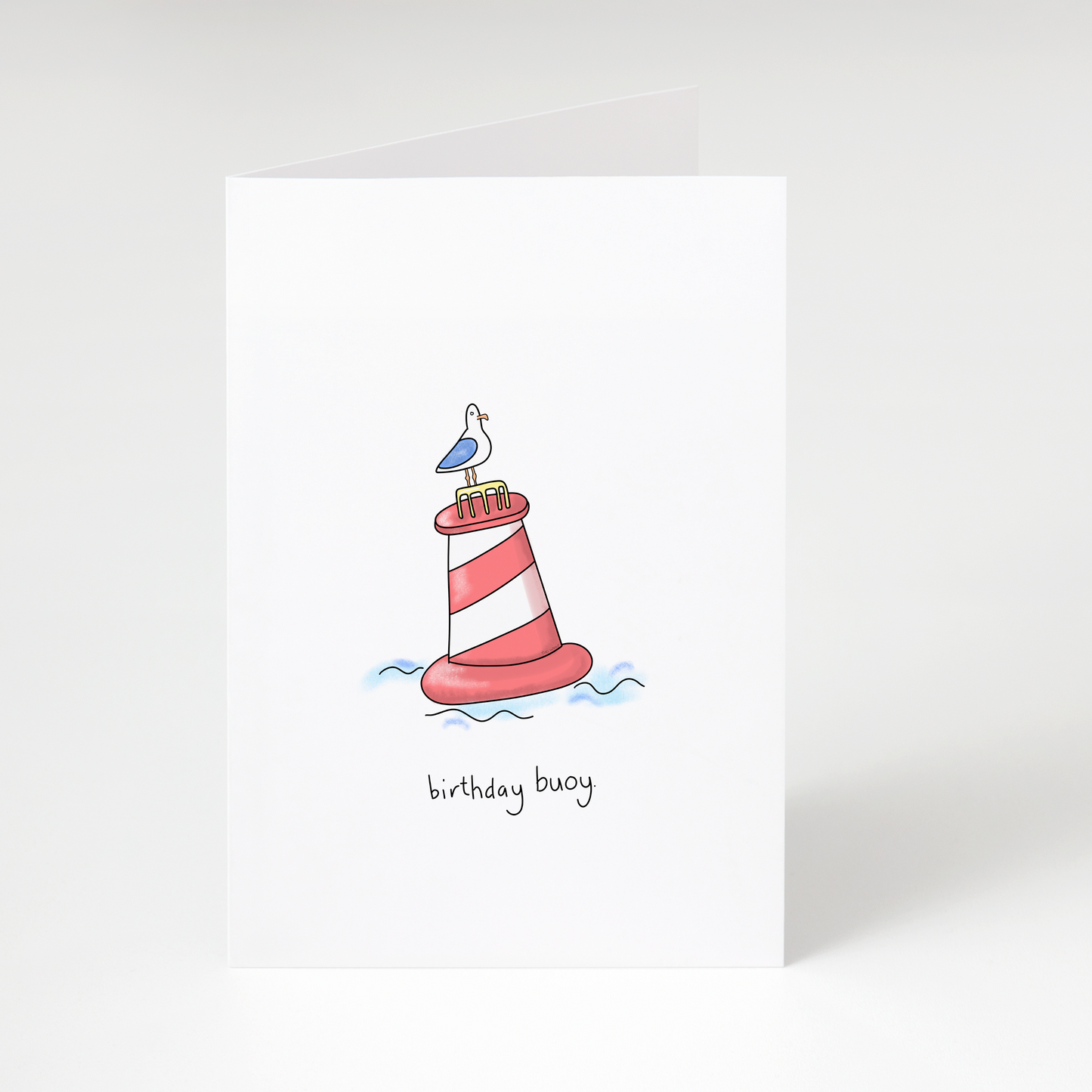 Lighthouse buoy with seagull and text “birthday buoy” on white funny nautical birthday greeting card
