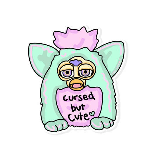 Kawaii pastel furby-inspired sticker with sleepy eyes and text “Cursed but Cute,” mint green and pink retro-style vinyl sticker on white background.