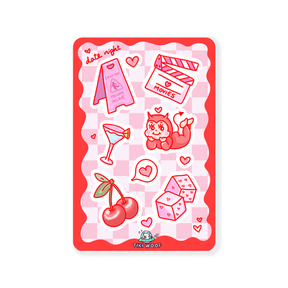 Mini sticker sheet with red and pink love-themed designs including cherries, dice, martini glass, movie clapper, and a devil mermaid on a checkered background.```