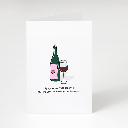 Wine bottle and glass with text “If you were wine, you would be too expensive” on white funny birthday greeting card
