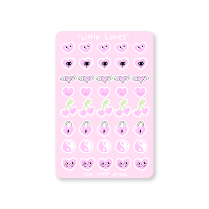 Little Loves pink sticker sheet featuring pastel kawaii heart, cherry, and winged designs by Tiki Woof Studio on a soft pink background.