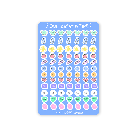 One Day at a Time journaling sticker sheet featuring pastel kawaii icons like water bottles, suns, fruits, hearts, and faces by Tiki Woof Studio on a blue background.
